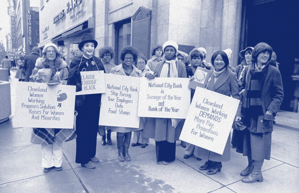 9to5 women holding picket signs